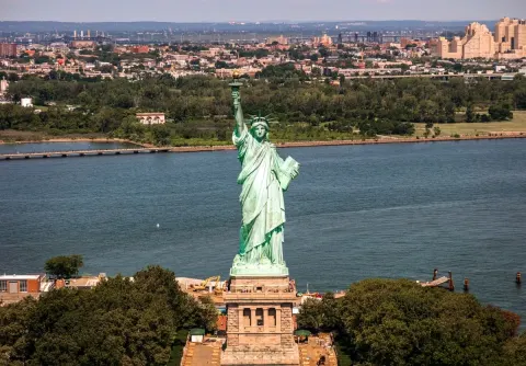 The Statue of Liberty at 140: the broken chain and the promise of welcome