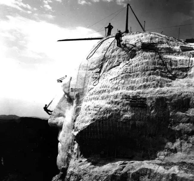 Workers on the face of George Washington (nps.gov).